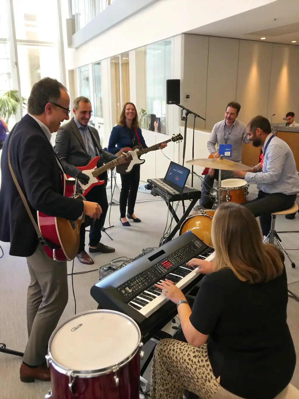 A vibrant image of a diverse group of people participating in an ASSO RXP music workshop, showcasing engagement and community interaction.